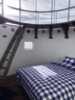Lighthouse tower suite with bed from Hästens.