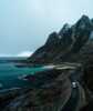 Motorhome car driving on road i beautiful nature surroundings on Andøya.