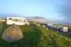 Sunset at campsite wirh tents and mobile homes.